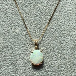 Macy’s 14k yellow gold white opal pendant on serpentine chain necklace